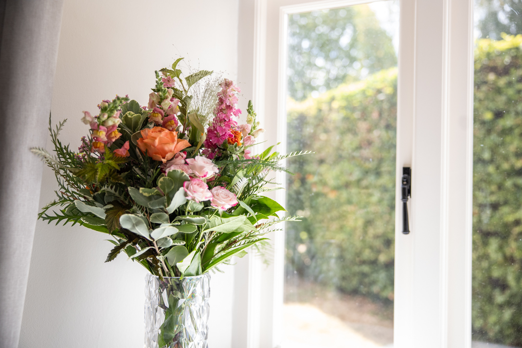 Fresh flowers by the window